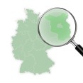Deutschlandkarte - eine Lupe zeigt vergrößert das Land Brandenburg an.